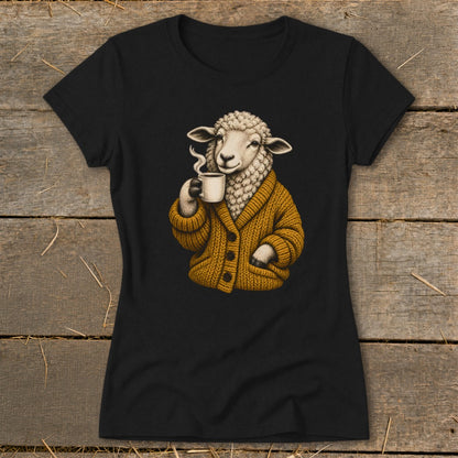 Black t-shirt featuring a graphic of a sheep wearing a mustard cardigan and drinking coffee.