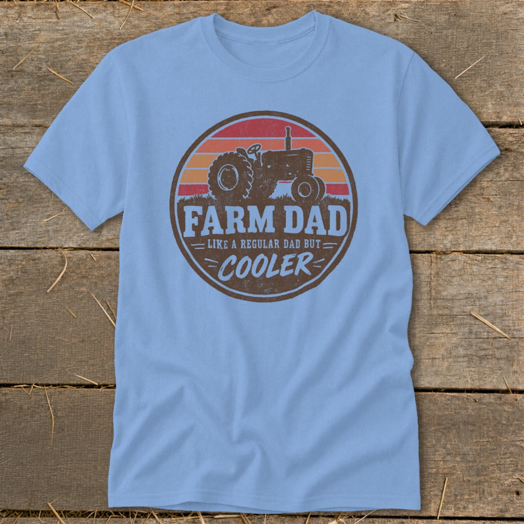Light blue t-shirt featuring a distressed round graphic with a tractor and text reading Farm Dad.