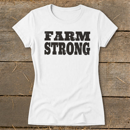 A white short-sleeved t-shirt with the words FARM STRONG printed in black across the chest.