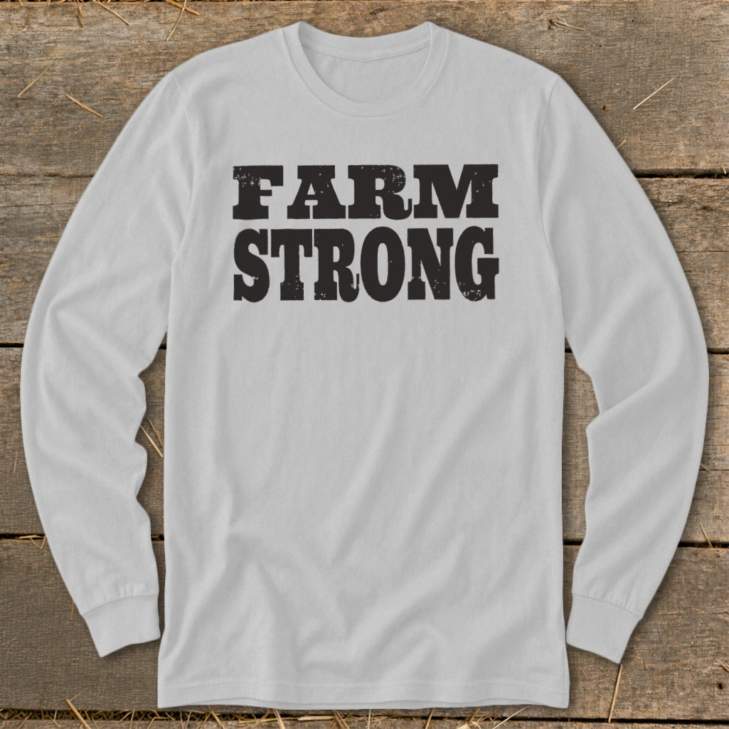 Light gray long-sleeve t-shirt with black distressed text reading "FARM STRONG" displayed centrally.
