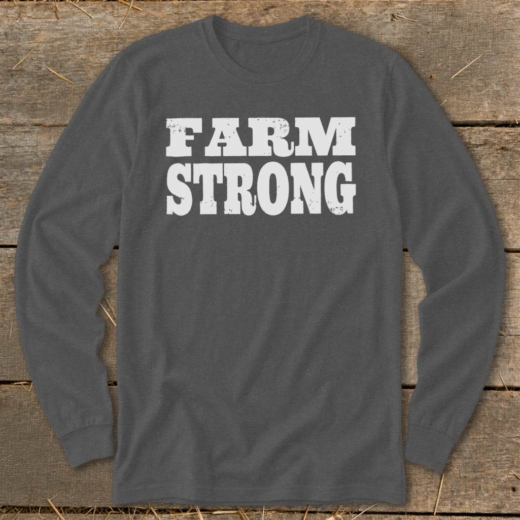 A dark gray long-sleeved t-shirt with the white distressed text FARM STRONG printed across the chest.