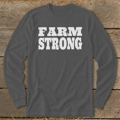 A dark gray long-sleeved t-shirt with the white distressed text FARM STRONG printed across the chest.