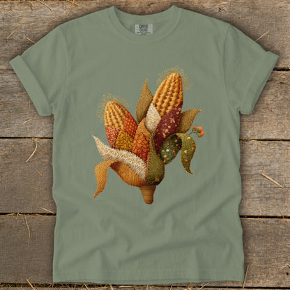 Green t-shirt with quilted corn and fall leaves graphic.