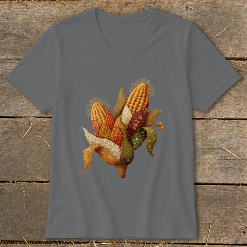 Corn illustration on a grey v-neck t-shirt with a wooden background.