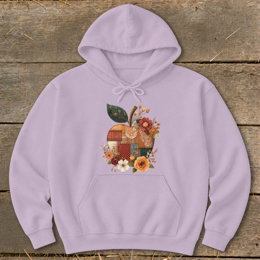 Lilac hoodie with a quilted apple graphic featuring flowers and leaves.
