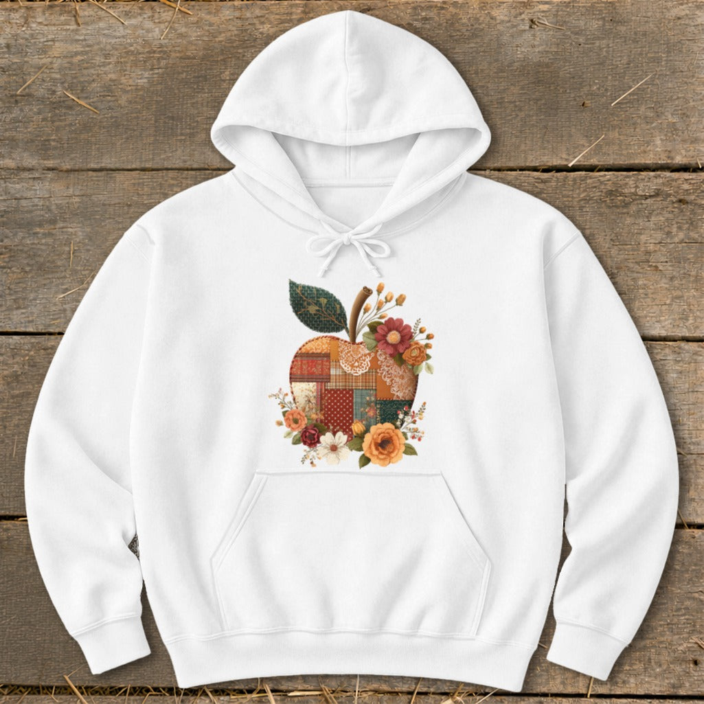 White hoodie with a quilted apple and floral design on the chest.