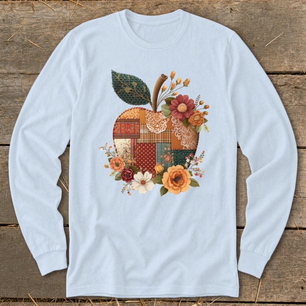 Light blue long-sleeve t-shirt with a patchwork apple floral graphic.