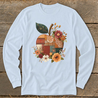 Light blue long-sleeve t-shirt with a patchwork apple floral graphic.