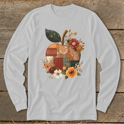 Long sleeve shirt with a quilted apple design and floral accents.