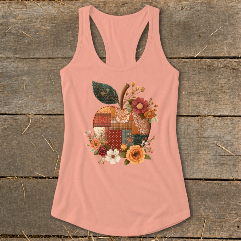 Peach tank top with a patchwork apple design surrounded by flowers.