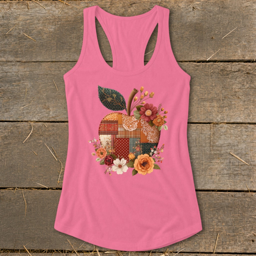 Pink tank top with a patchwork apple graphic and floral accents.