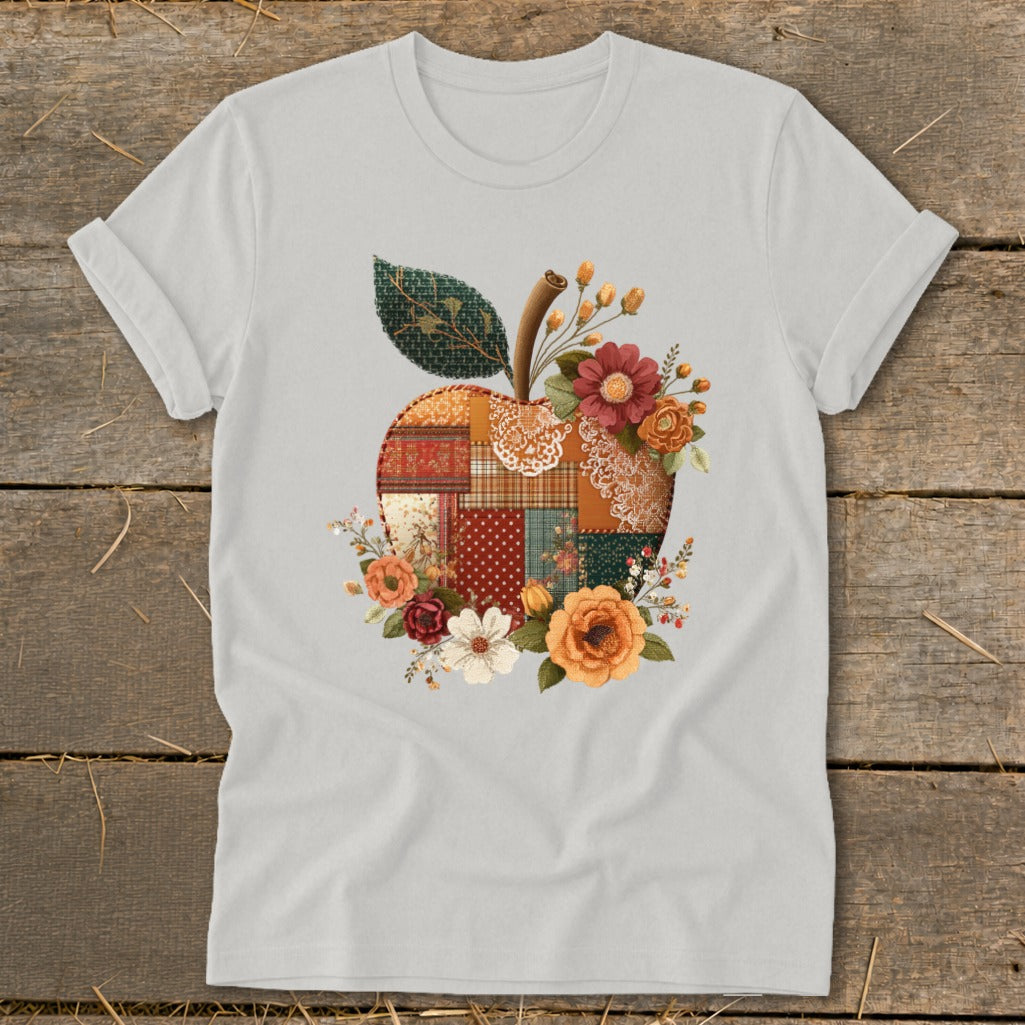 Light grey t-shirt with a patchwork apple and floral design.