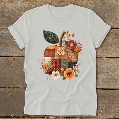 Light grey t-shirt with a patchwork apple and floral design.