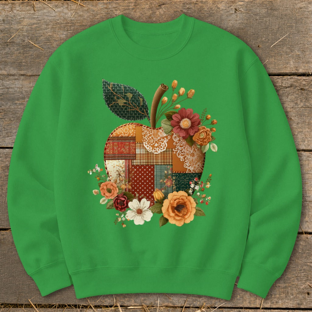 Green sweatshirt with patchwork apple design and floral accents.