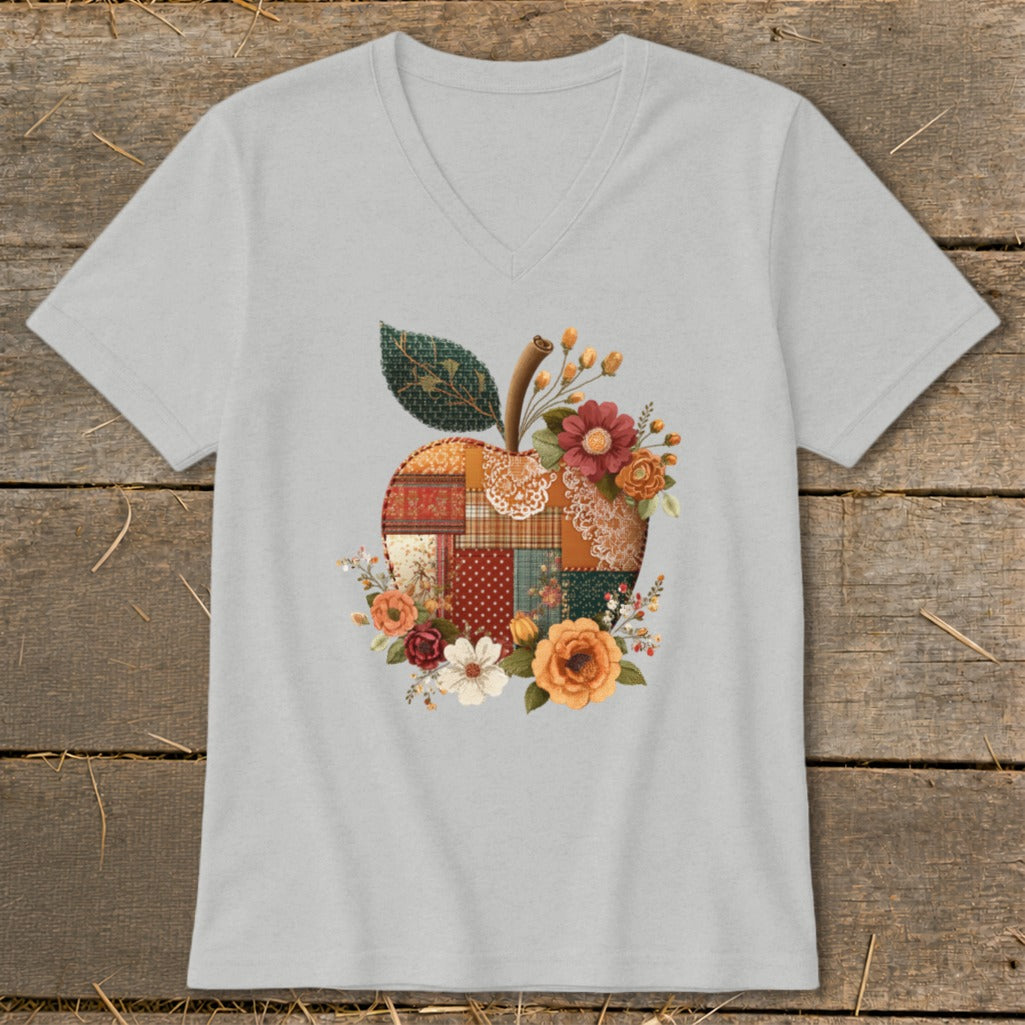 Gray v-neck t-shirt with a patchwork apple and floral design.