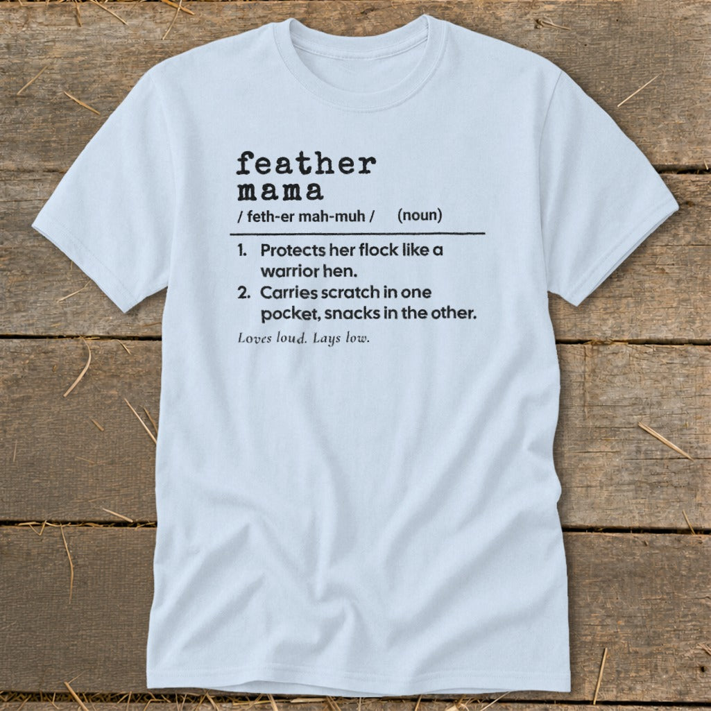 Light blue t-shirt with "feather mama" definition printed in black.