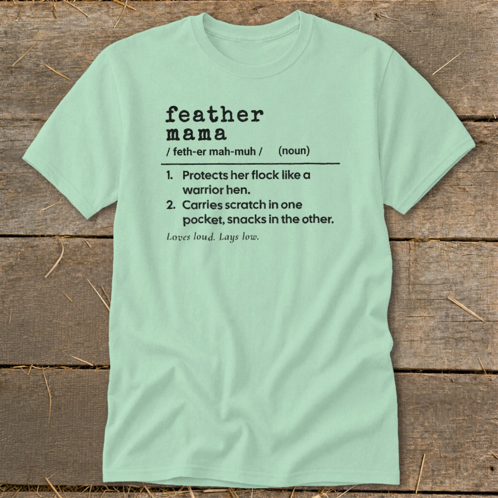 Light green t-shirt with "feather mama" definition and phrases.