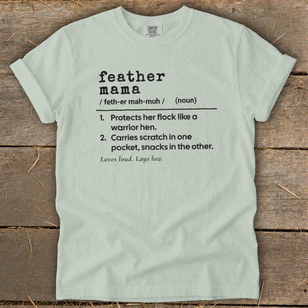 Light green t-shirt with "feather mama" definition and Comfort Colors tag.