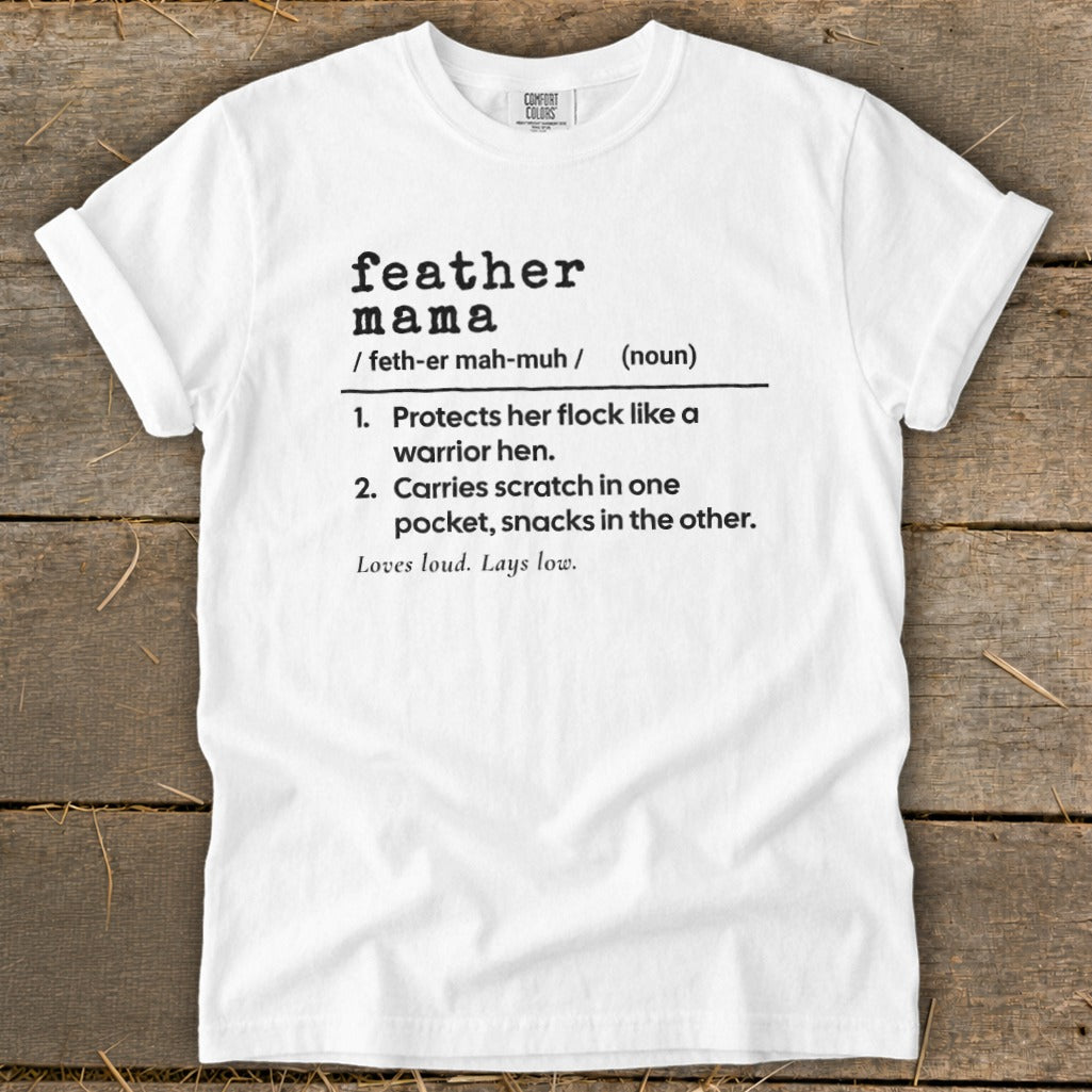 White Comfort Colors t-shirt with "feather mama" definition printed in black.