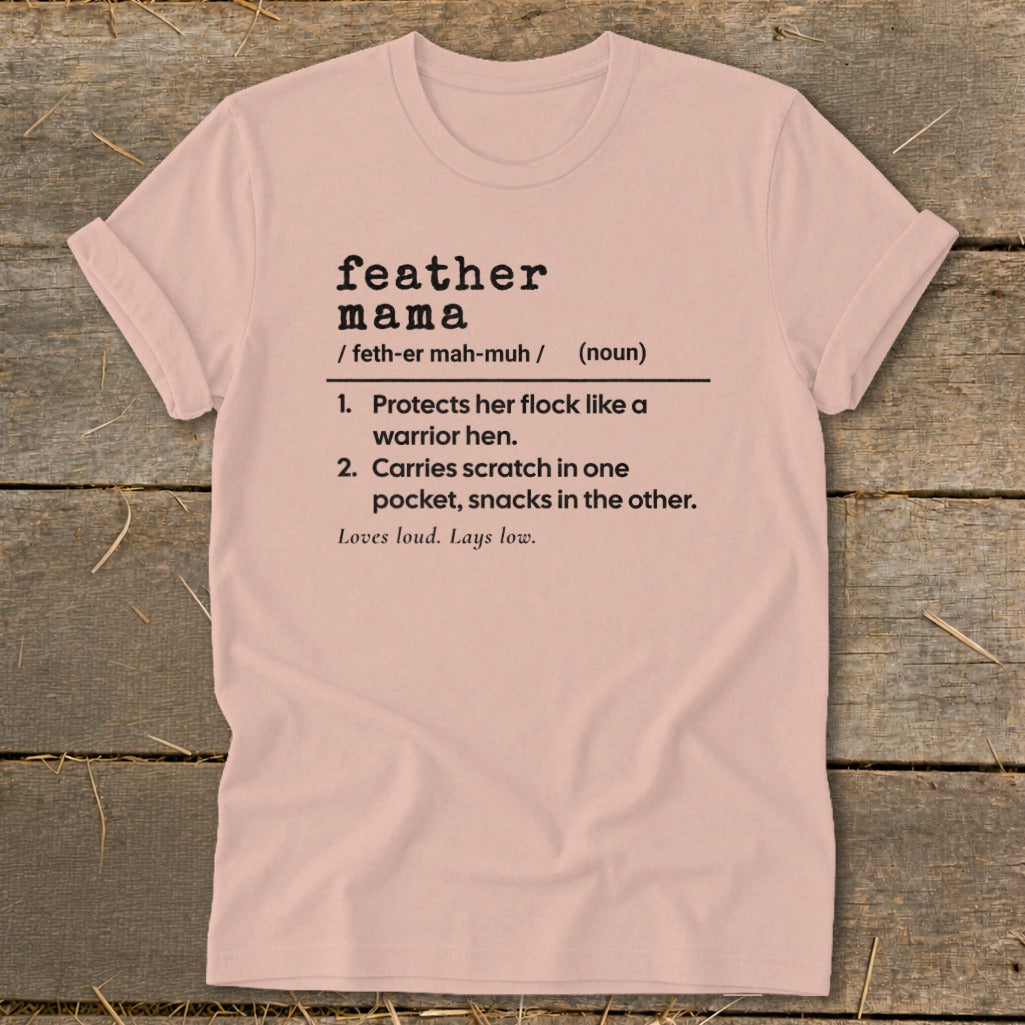 Pink t-shirt with definition of "feather mama" printed on it.