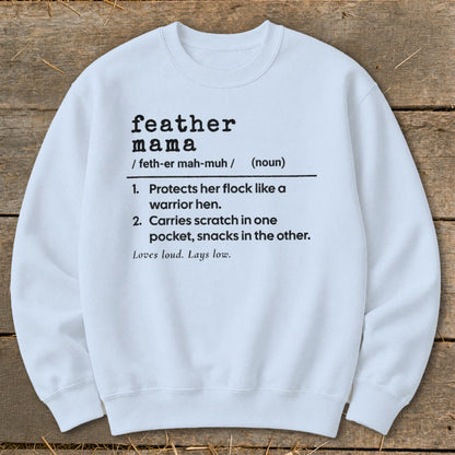 White sweatshirt with "feather mama" definition printed in black text.