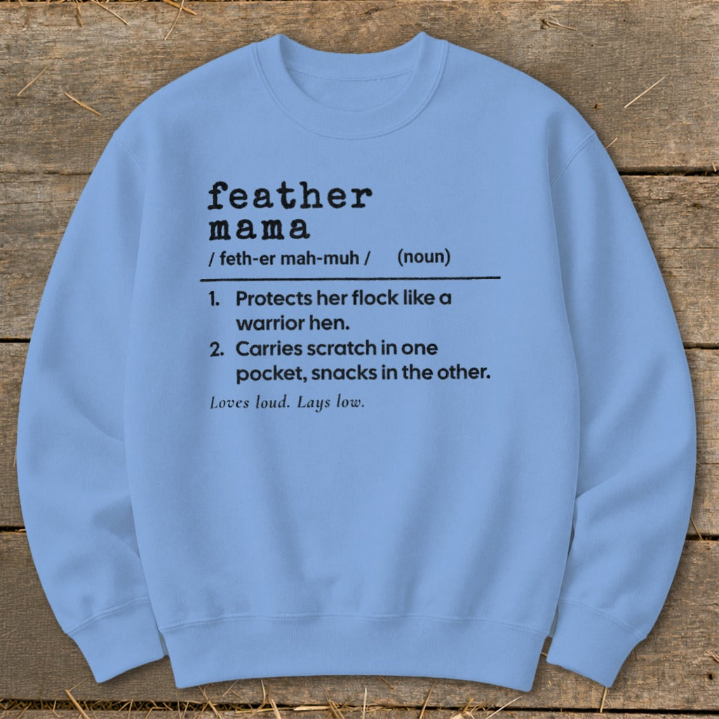 Light blue sweatshirt with "feather mama" definition in black text.