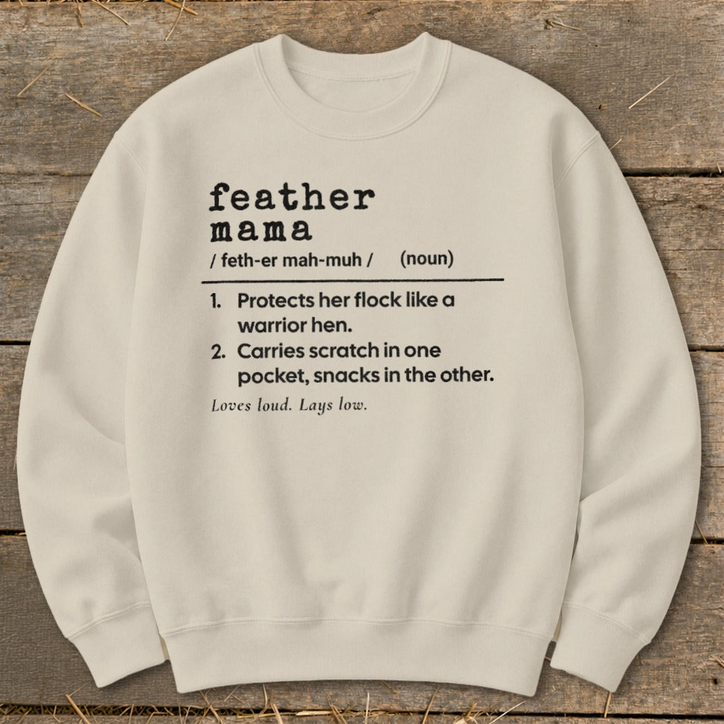 Cream sweatshirt with "feather mama" definition: Protects flock, carries snacks.