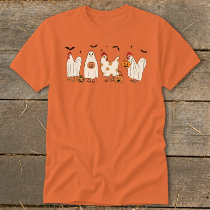 Cute chickens dressed as ghosts holding pumpkins with bats overhead.