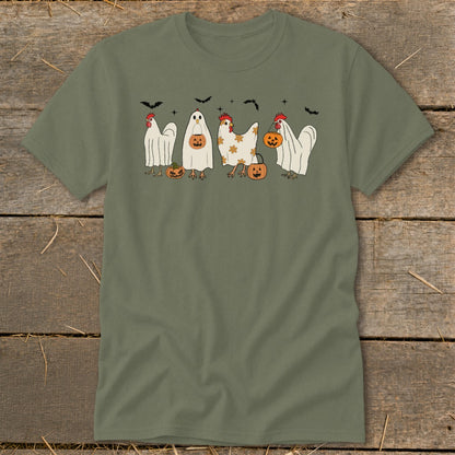 Chickens in ghost costumes with pumpkins and bats for Halloween.