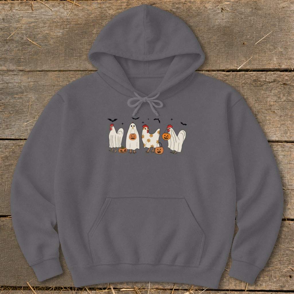 Halloween chickens in costumes with pumpkins and bats.