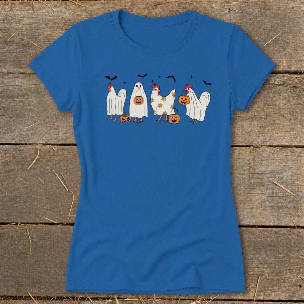Chickens in ghost costumes with pumpkins and bats, spelling "MAXM".
