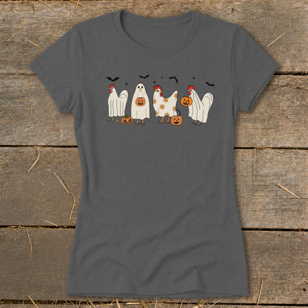 Chickens dressed as ghosts and pumpkins with bats overhead.