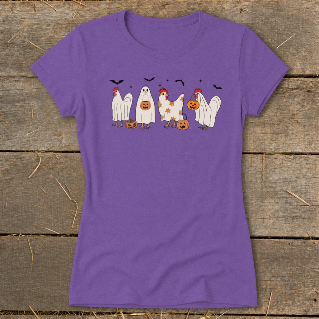 Purple t-shirt featuring chickens dressed as ghosts with pumpkins and bats.
