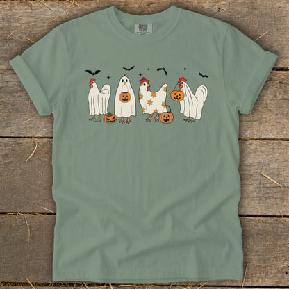 Green t-shirt with chickens dressed as ghosts, holding pumpkins, with bats overhead.