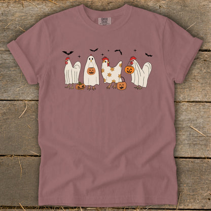 T-shirt graphic featuring chickens in ghost costumes with pumpkins and bats.
