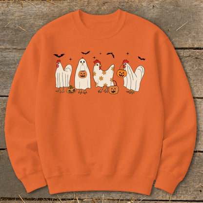 Orange sweatshirt with four chickens dressed in ghost costumes holding pumpkins.