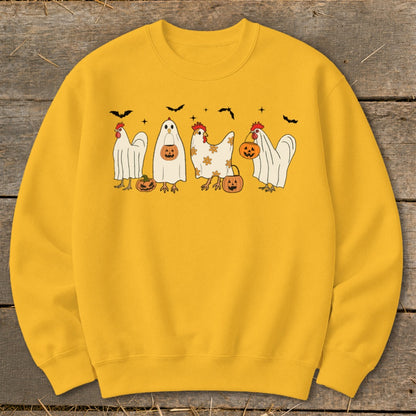 Yellow sweatshirt with chickens in Halloween costumes and pumpkins.