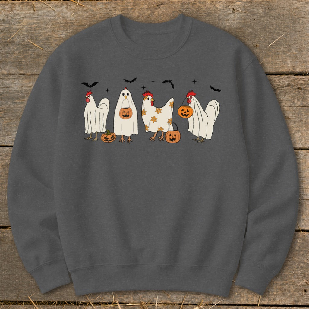 Four chickens dressed as ghosts with pumpkins and bats, on a dark gray sweatshirt.