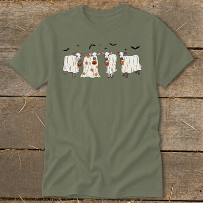 Four cows in ghost costumes with pumpkins and bats on a green t-shirt.