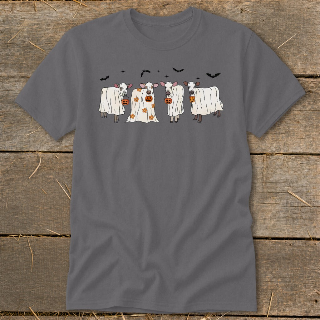 Four cows in ghost costumes with jack-o'-lanterns and bats.