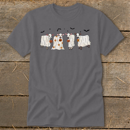 Four cows in ghost costumes with jack-o'-lanterns and bats.