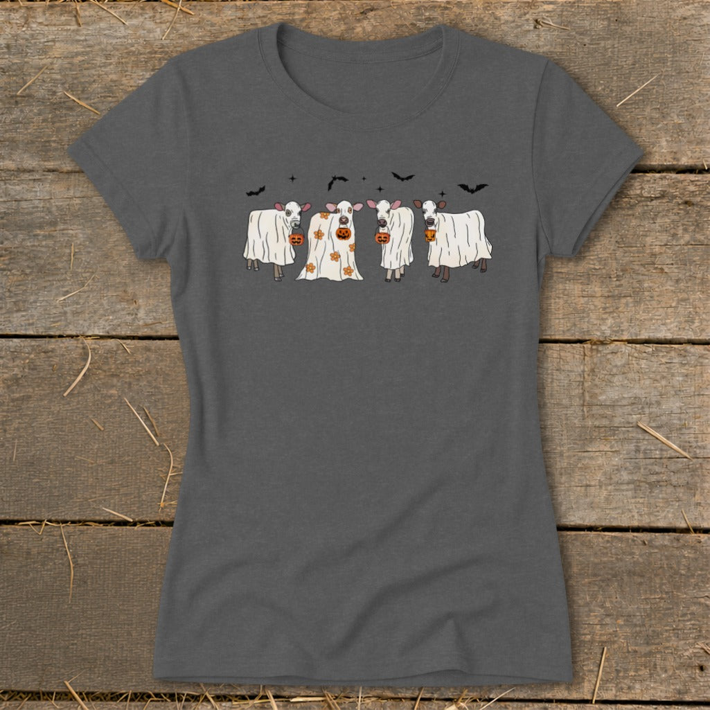 Four cartoon cows in ghost costumes with pumpkins on a grey t-shirt.