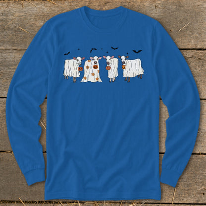 Four cows dressed as ghosts hold pumpkins under bats and stars.