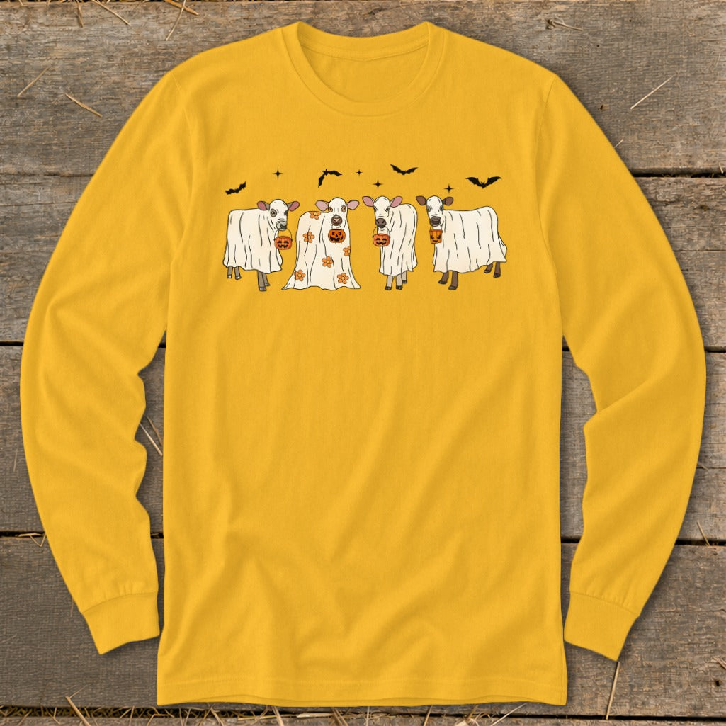 Four cows dressed as ghosts hold jack-o'-lanterns with bats and stars.