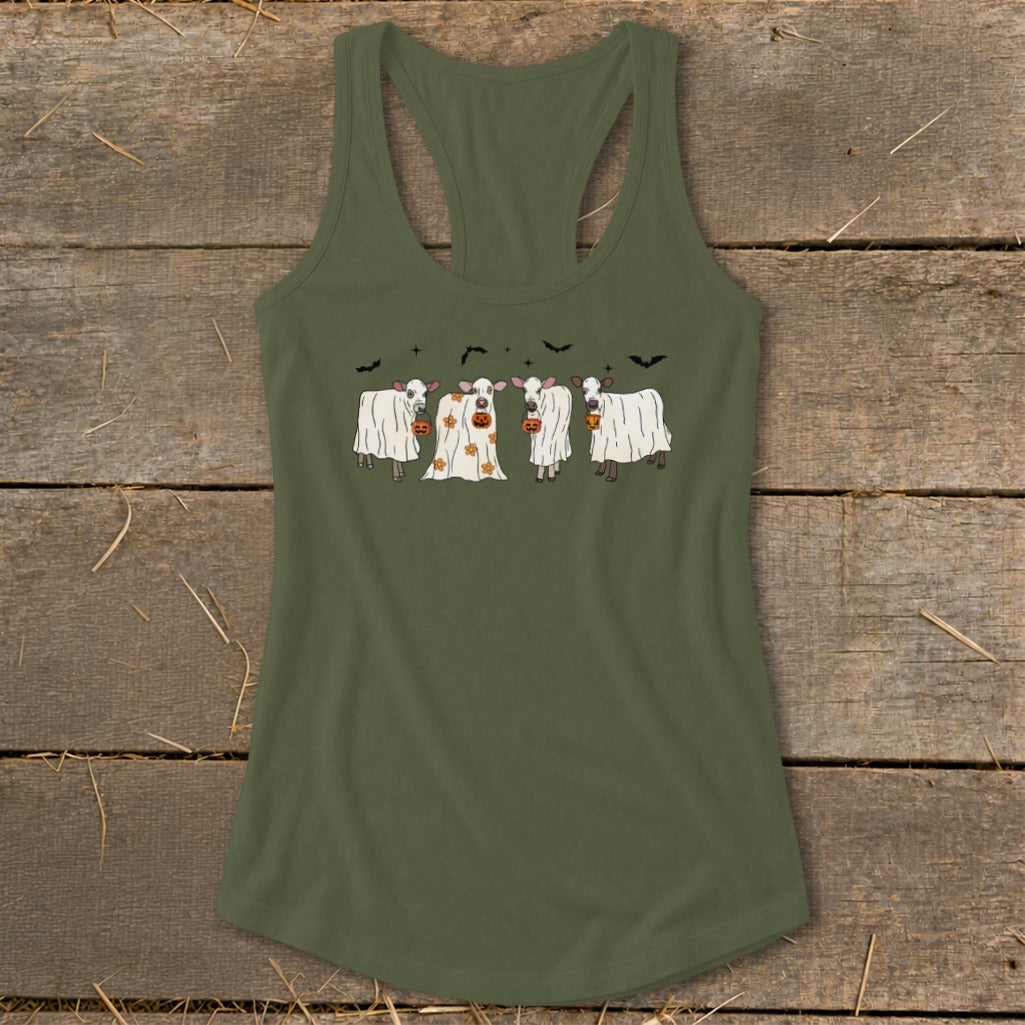 Ghost cows with pumpkins and bats Halloween graphic on a green tank top.
