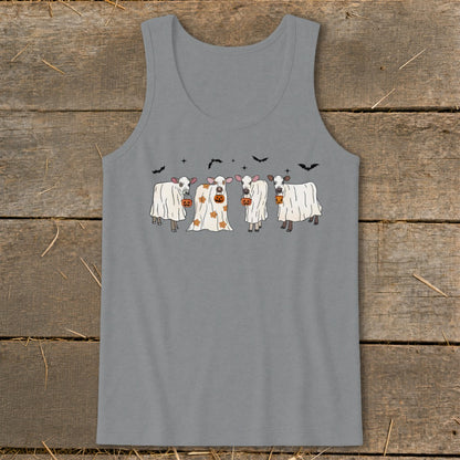 Four cows in ghost costumes with pumpkins and bats celebrate Halloween.