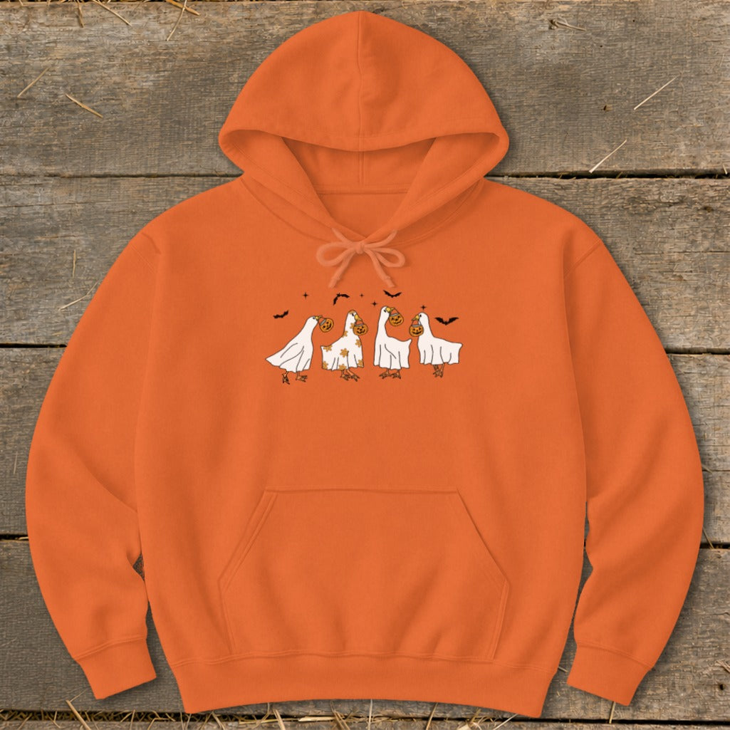 Orange hoodie with cartoon ghosts carrying pumpkins and bats on the front.