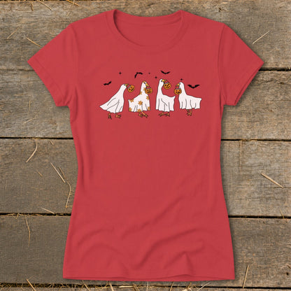 T-shirt with cartoon ghosts trick-or-treating with pumpkins and bats.