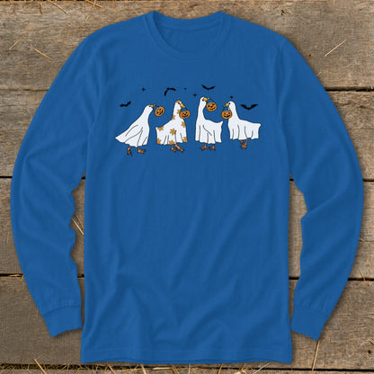 Four geese in ghost costumes carrying pumpkins with bats in the background.