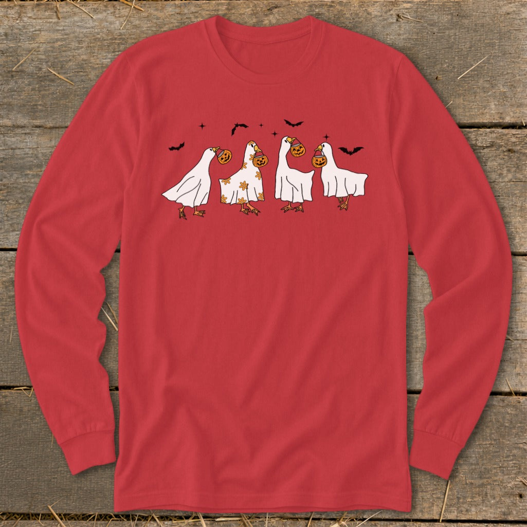 Red long-sleeve shirt with four cartoon geese in ghost costumes and carrying pumpkins.